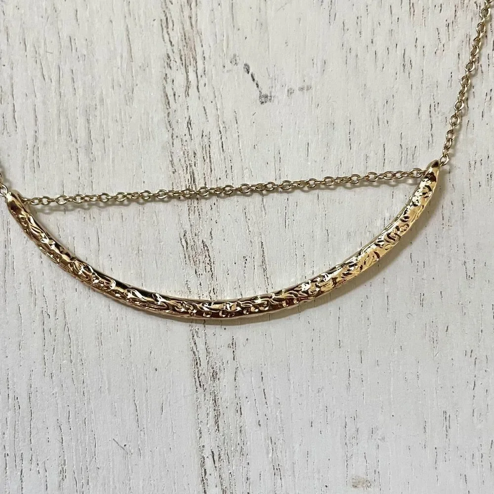 Gold tone pendant necklace